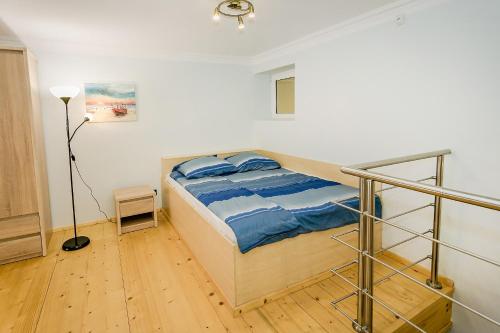 Ένα ή περισσότερα κρεβάτια σε δωμάτιο στο Apartament MICKIEWICZA