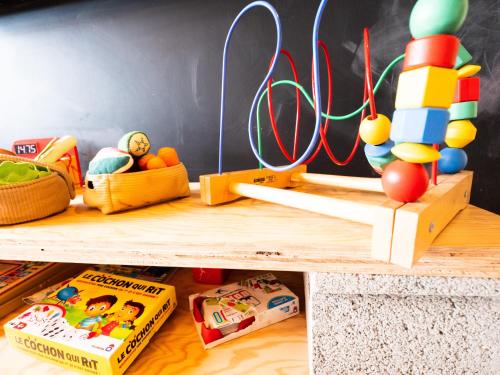 a childs play room with toys on the floor at greet Hotel Beaune in Beaune