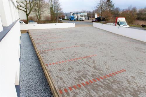 a roof of a building with red lines on it at Amplidi Hotel Hannover in Hannover