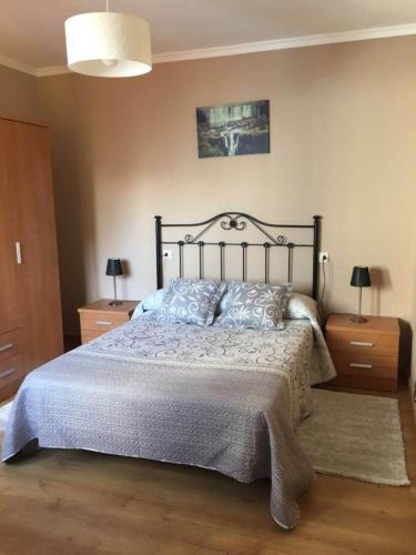 A bed or beds in a room at Pisos Turísticos Muxía -Teresa Barros