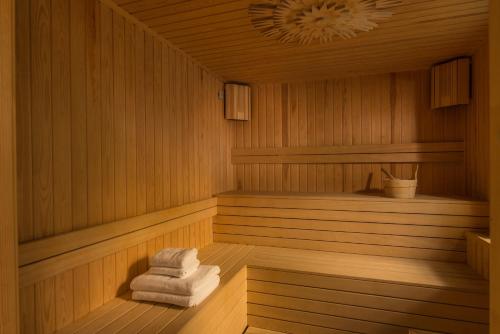 a sauna with three towels sitting in it at Zaara Estate Winery Hotel & SPA in Glavan