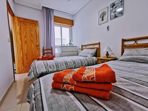 Säng eller sängar i ett rum på El Sombrero Apartment with free WIFI Playa del Cura