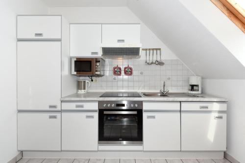 Η κουζίνα ή μικρή κουζίνα στο Ferienwohnung Backbord