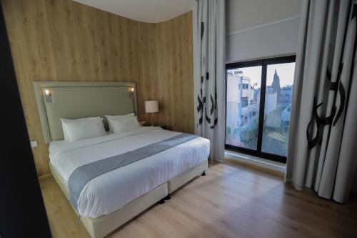 Voodi või voodid majutusasutuse La Locanda Boutique Hotel toas