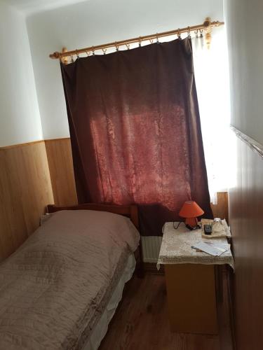Una cama o camas en una habitación de Boróka Vendégház