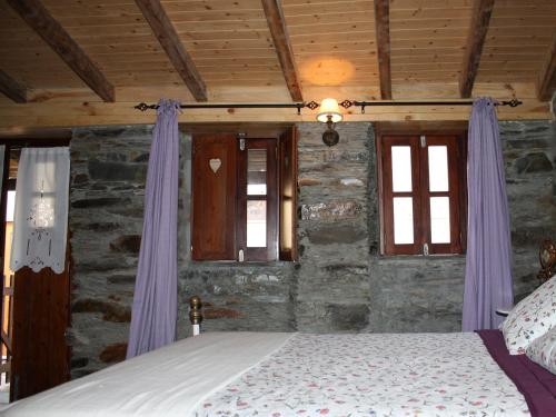 Postel nebo postele na pokoji v ubytování Casa Aigra
