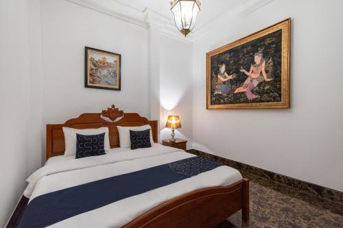 Postel nebo postele na pokoji v ubytování Capital O 805 Suan Palm Farm Nok Resort