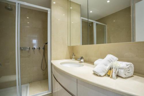 a bathroom with a sink and a shower at Bright One BDRM Apartment AC-Congress, Beaches by Olidesi in Cannes