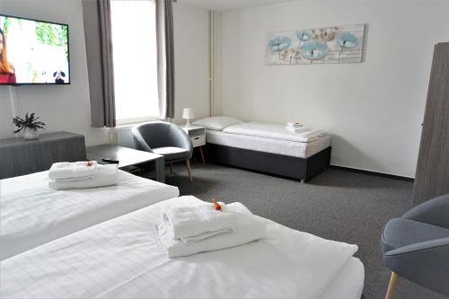 Ένα ή περισσότερα κρεβάτια σε δωμάτιο στο Apartment Pension Stark