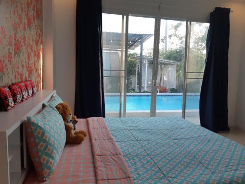 Postel nebo postele na pokoji v ubytování Pimjai Party Pool Villa Huahin 2 Bedroom