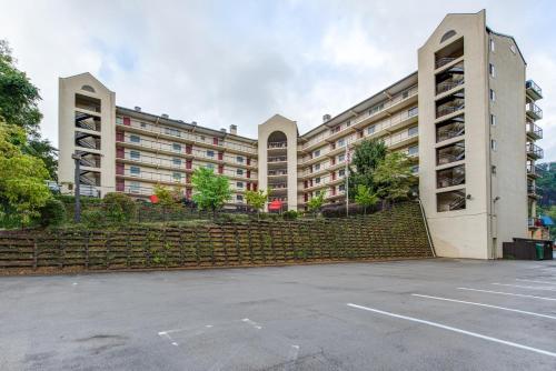 a large building with a parking lot in front of it at Gatlinburg Chateau Rentals in Gatlinburg