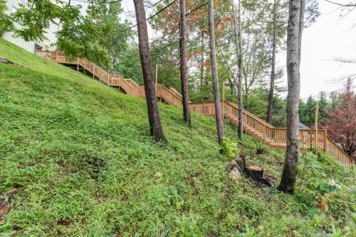 a hill with trees and a staircase in the woods at Laurel Inn in Gatlinburg