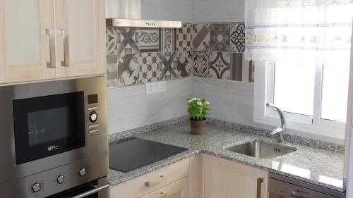 Η κουζίνα ή μικρή κουζίνα στο Apartamento AGUA AZUL
