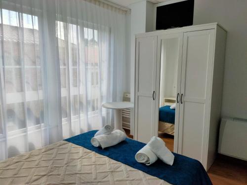 Postel nebo postele na pokoji v ubytování Lar do Peregrino