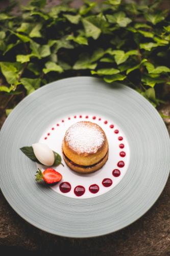 a pastry on a plate on a table at Le Moulin du Roc in Brantôme