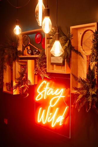 a sign that says stay wild in a room at Firefly in Bray