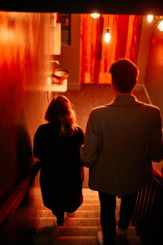 a man and a woman walking down the stairs at Firefly in Bray