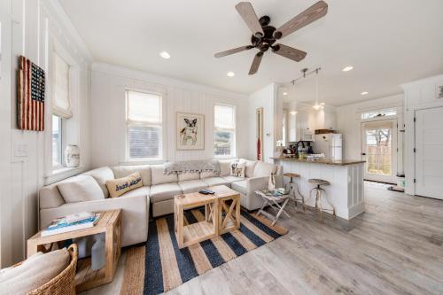 a living room with a couch and a ceiling fan at Dog Paddle in Lincoln City
