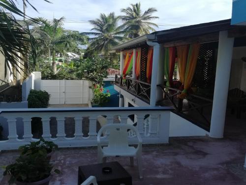 a balcony of a house with a white railing at House Jardin Del Caribe in Las Terrenas
