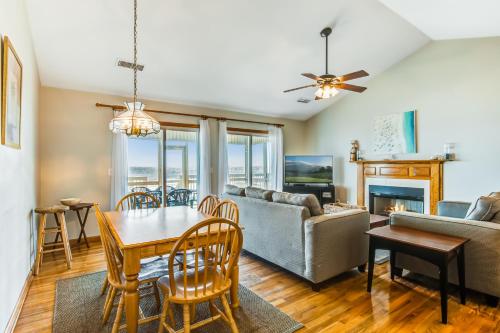 a living room with a table and a couch at Turtle Watch II in Folly Beach