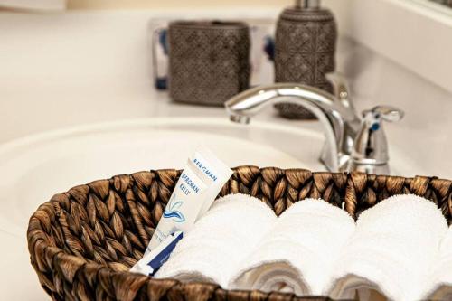 a basket filled with books sitting in a sink at Beautiful Apartment Steps Away from the Beach in Miami Beach