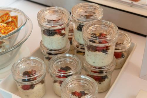 a group of jars of food sitting on a table at Grand Hotel Cravat in Luxembourg