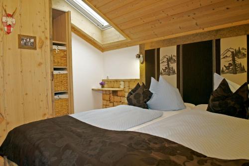 a bedroom with a large bed in a room at Pension Willibald in Bad Tölz