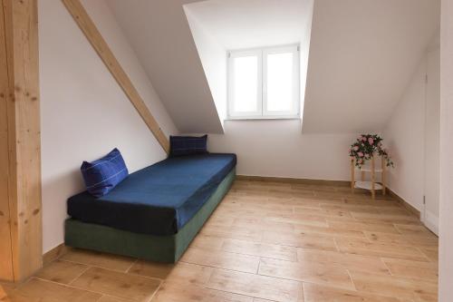 a small room with a bed in a attic at Hotel Ludwig in Munich