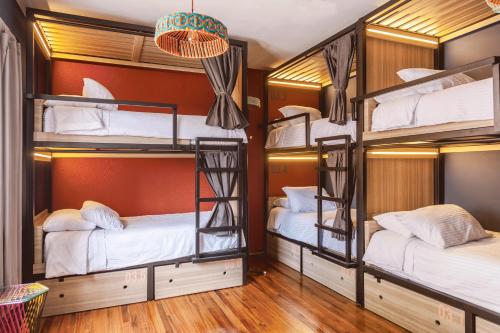 Cama o camas de una habitación en Bendito Hostels