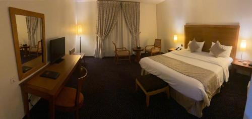 מיטה או מיטות בחדר ב-Doolve Hotel Al Khobar