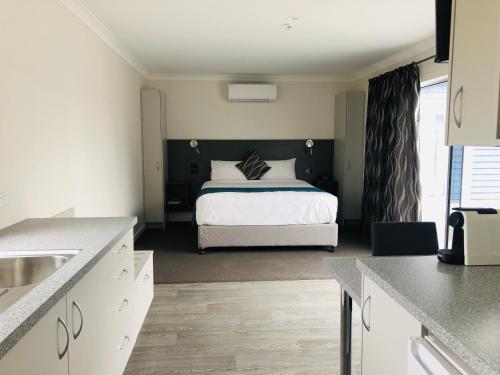 Ένα ή περισσότερα κρεβάτια σε δωμάτιο στο Thornton Lodge Motel