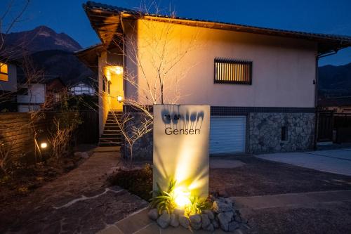 a sign in front of a house at night at Bettei Gensen-Private Vacation Villa Bettei Gensen in Yufu