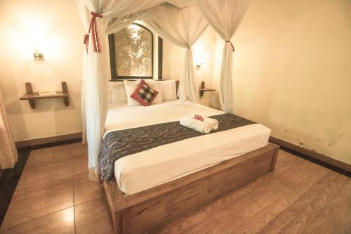 Cama o camas de una habitación en Trijaya Guest House Pemuteran
