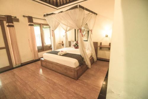 Cama o camas de una habitación en Trijaya Guest House Pemuteran