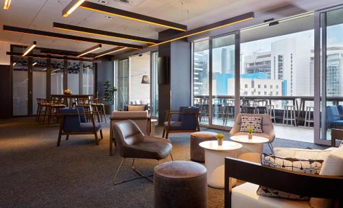 a large room with a view of a city at Holiday Inn Express Melbourne Southbank, an IHG Hotel in Melbourne