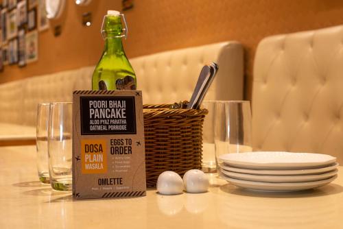 a bottle of wine sitting on top of a table at Bloom Boutique l Ranjit Avenue in Amritsar