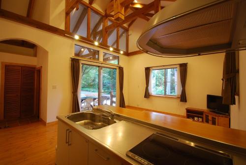 a kitchen with a sink and a counter top at Cottage All Resort Service / Vacation STAY 8401 in Inawashiro