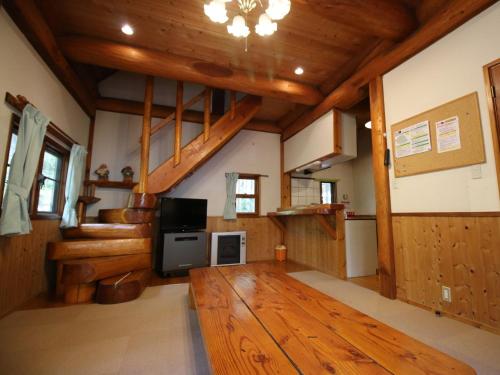 a large living room with wooden floors and wooden ceilings at Cottage All Resort Service / Vacation STAY 8422 in Inawashiro