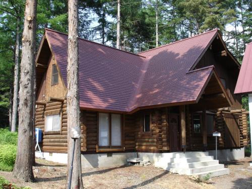 a log cabin with a metal roof at Cottage All Resort Service / Vacation STAY 8424 in Inawashiro