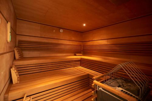 an empty wooden sauna with a wooden at Sportschule Oberhaching in Oberhaching