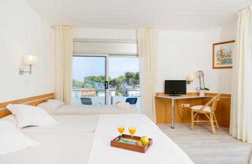 Postel nebo postele na pokoji v ubytování Hotel Ancora