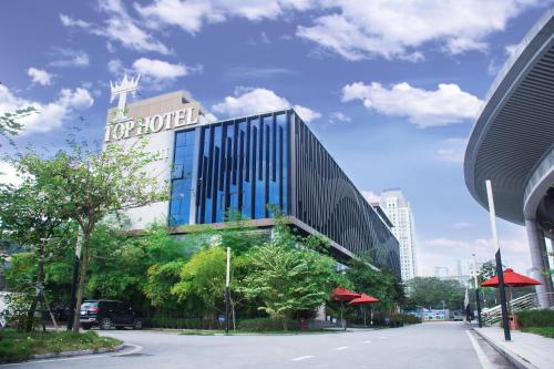 a hotel building with a sign on top of it at Friendship hotel in Hanoi
