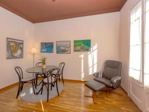 a dining room with a table and chairs at Apartment Eixample Esquerre Arago Rocafort by Interhome in Barcelona