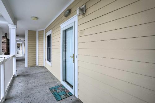a front door of a house with a building at Magnolia Pointe Myrtle Beach Condo on Golf Course! in Myrtle Beach