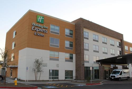 a hospital building with a van parked in a parking lot at Holiday Inn Express & Suites - Phoenix - Airport North by IHG in Phoenix