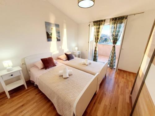 Postel nebo postele na pokoji v ubytování Apartman Šime