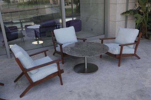 two chairs and a table and a table and chairs at ON'LIVE HOTEL in Cesme