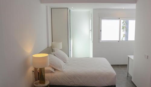 En eller flere senger på et rom på Balustrada Apartments