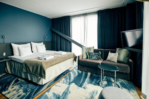 Postel nebo postele na pokoji v ubytování Clarion Hotel Post