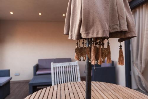 a wooden table with a rope hanging from it at Hotel Diamonds and Pearls in Antwerp